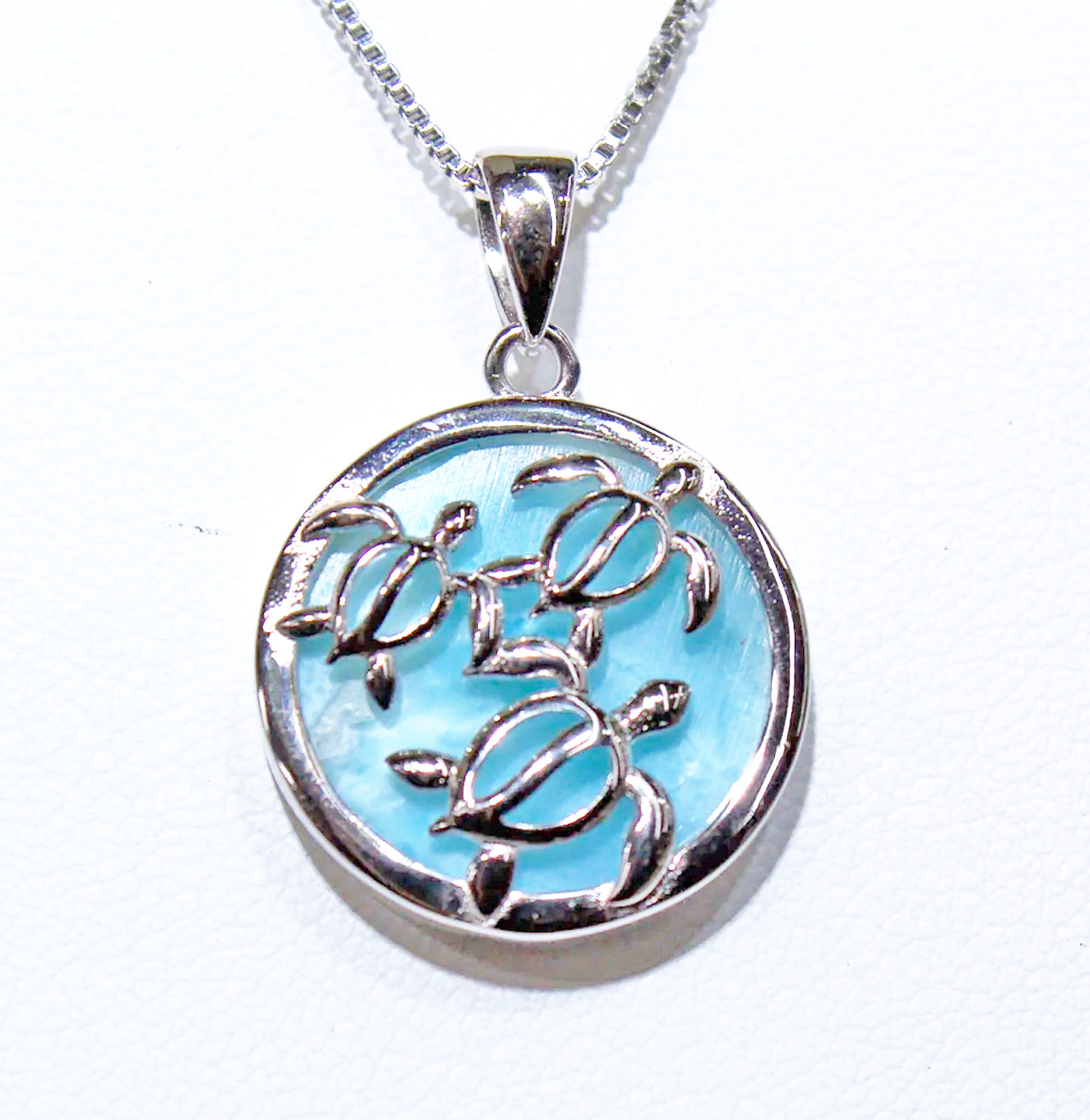 THREE TURTLES ON TOP OF BLUE LARIMAR STONE