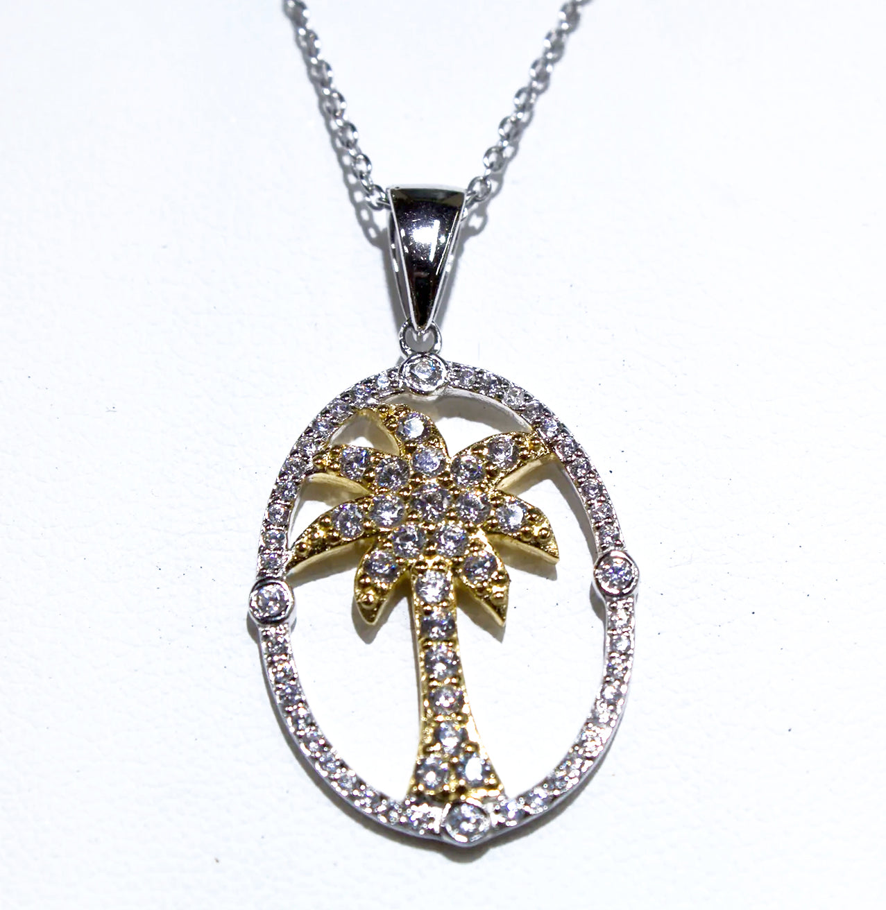 BEAUTIFUL SILVER AND GOLD PALM TREE LACED WITH WHITE ZIRCON
