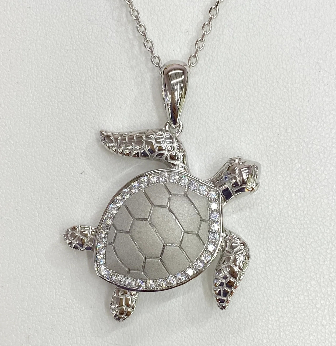 MANIFICENTLY STUNNING TURTLE PENDANT OUTLINED IN WHITE ZIRCON