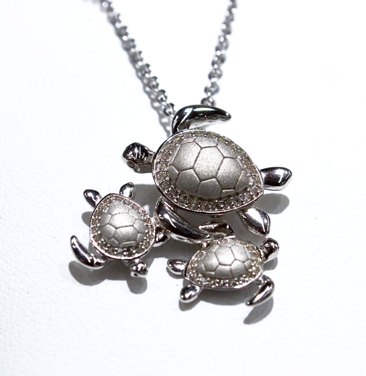 NATURAL MATTE AND SHINY SILVER TURTLE TRIO PENDANT