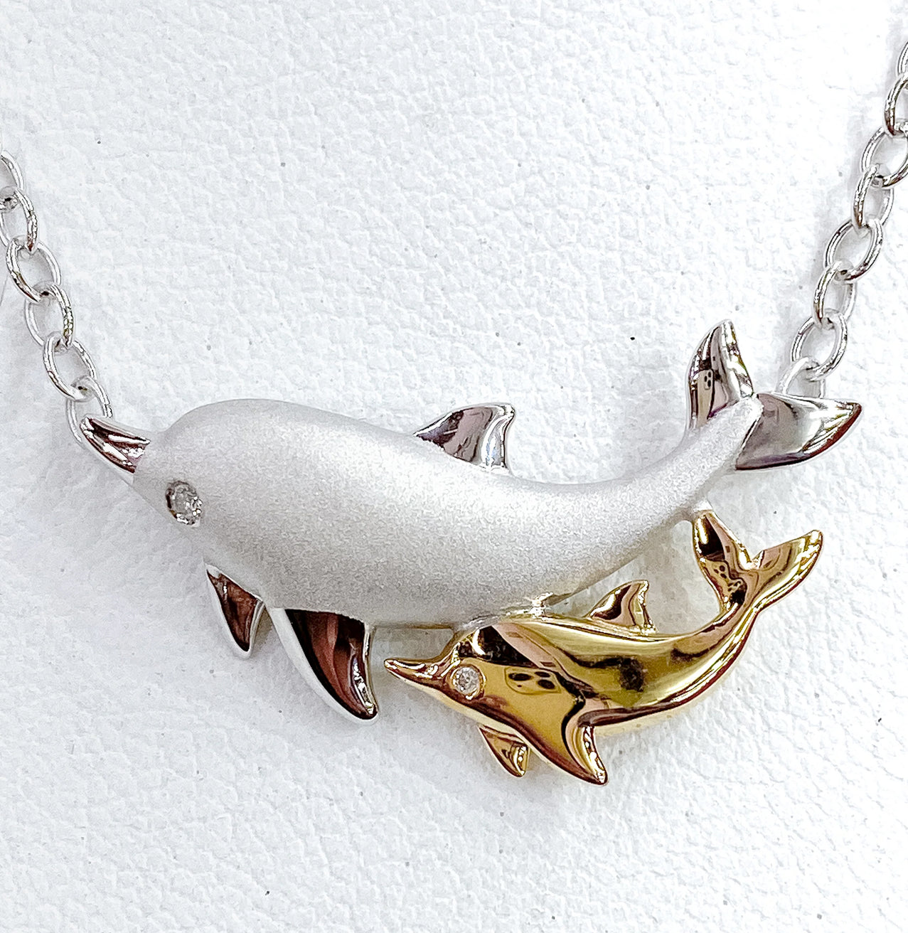 PLAYFUL MOTHER AND BABY DOLPHIN PENDANT WITH CHAIN