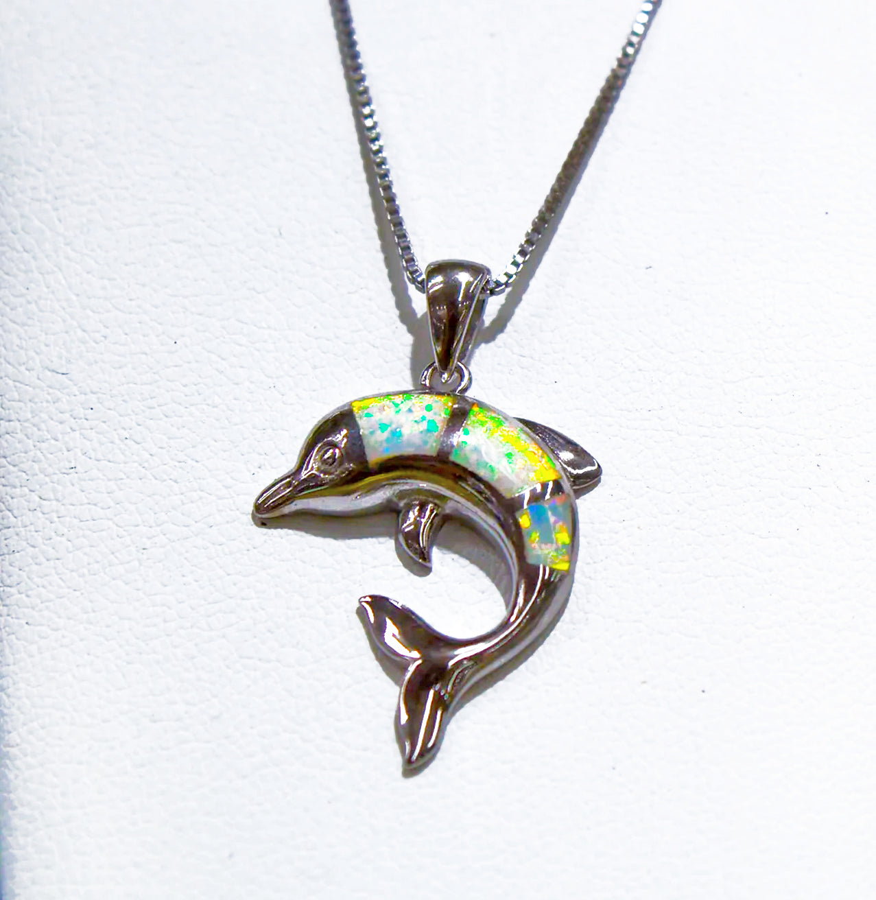 SMALL STERLING SILVER DOLPHIN WITH WHITE OPAL STONES