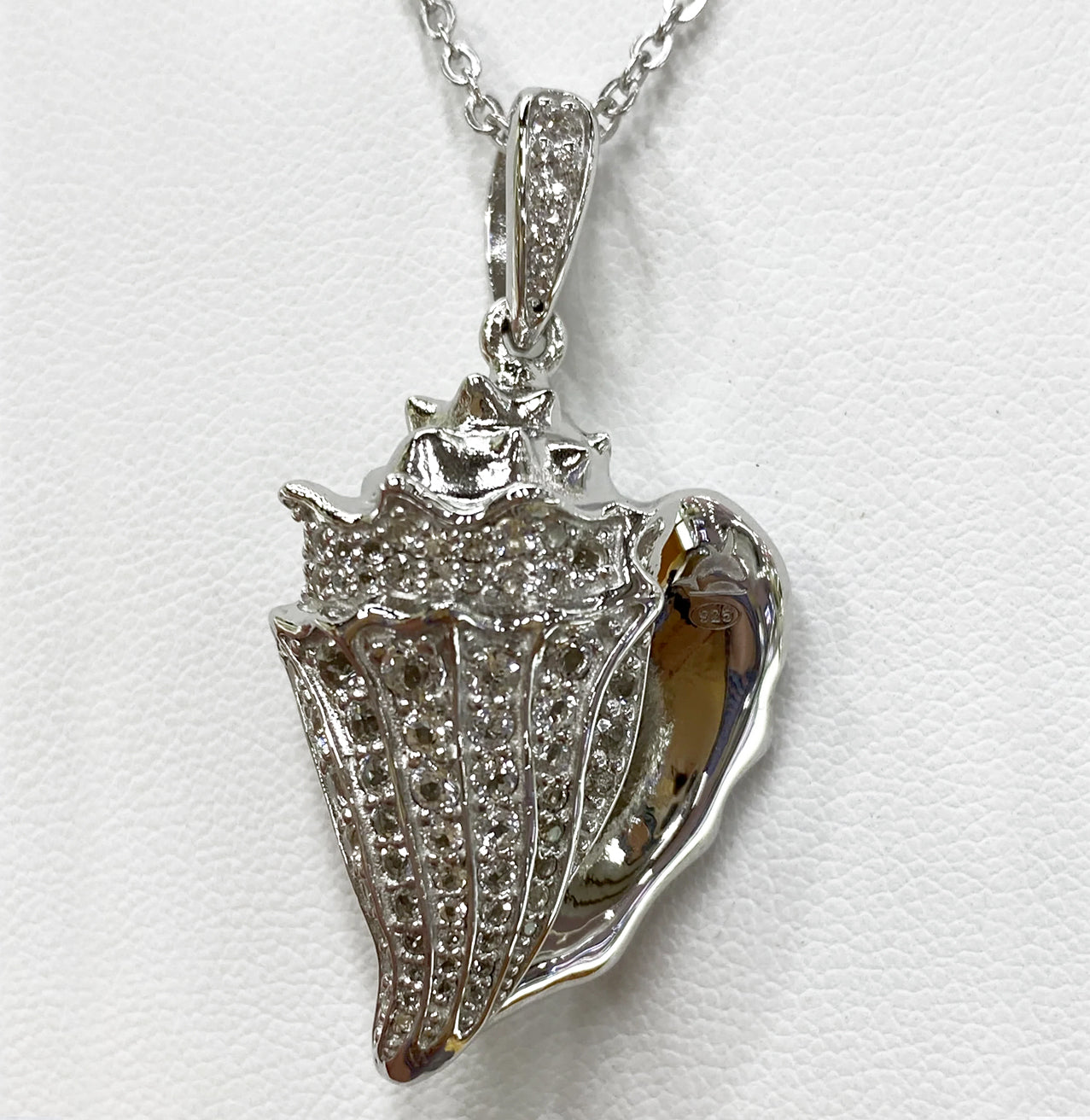 STERLING SILVER CONCH SHELL WITH WHITE TOPAZ