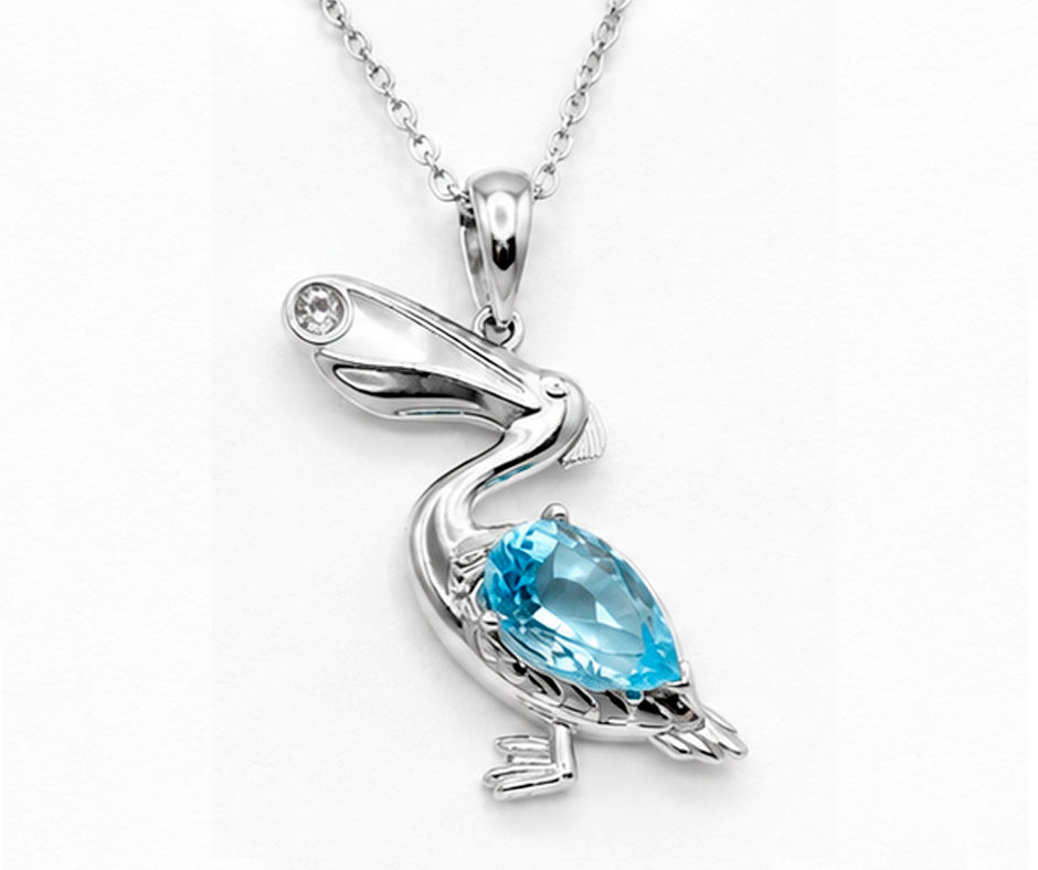 STERLING SILVER PELICAN WITH BLUE AND WHITE ZIRCON PENDANT